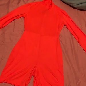 A hot pink one piece with long sleeves